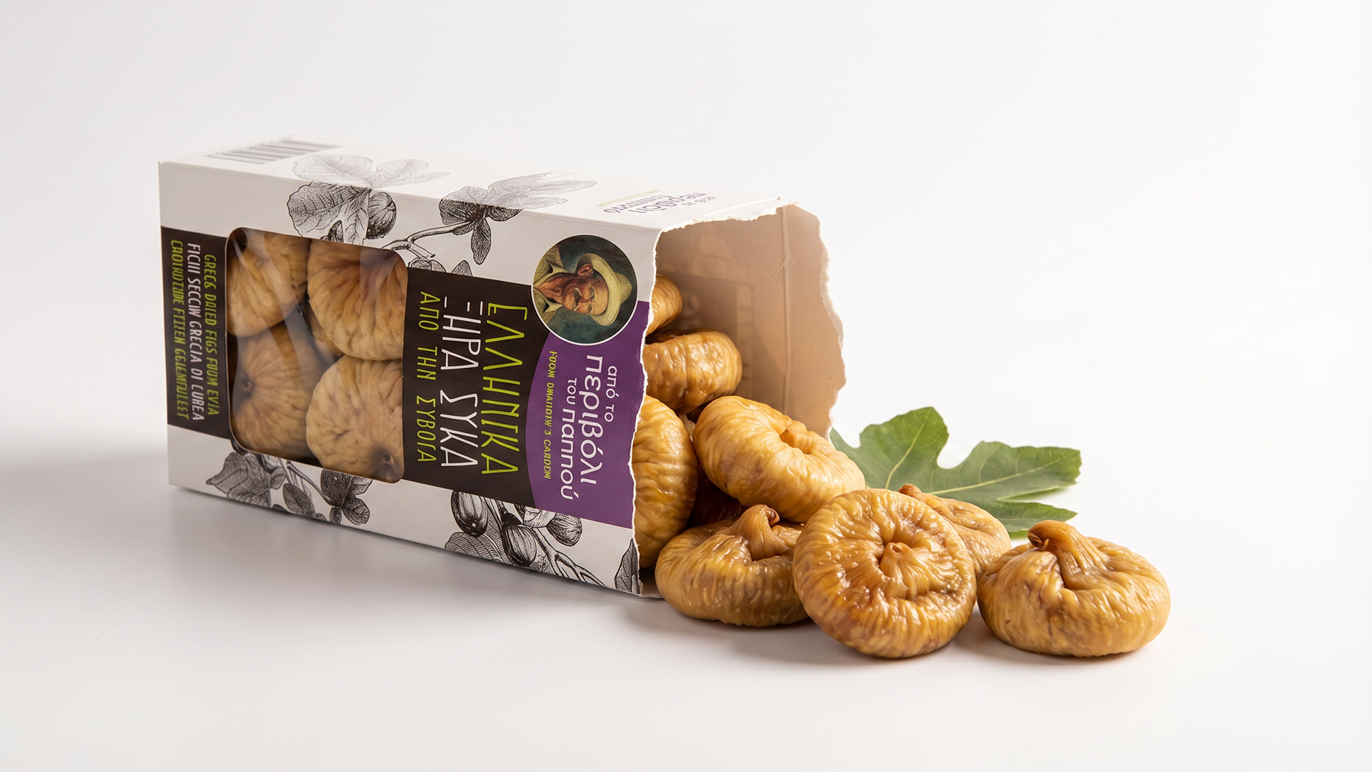 Award-winning conceptual packaging box for 'From Grandpa's Garden' Greek dried figs from Evia, featuring custom botanical sketches, heritage farmer portraiture, and spilled gourmet figs on a minimalist white background.