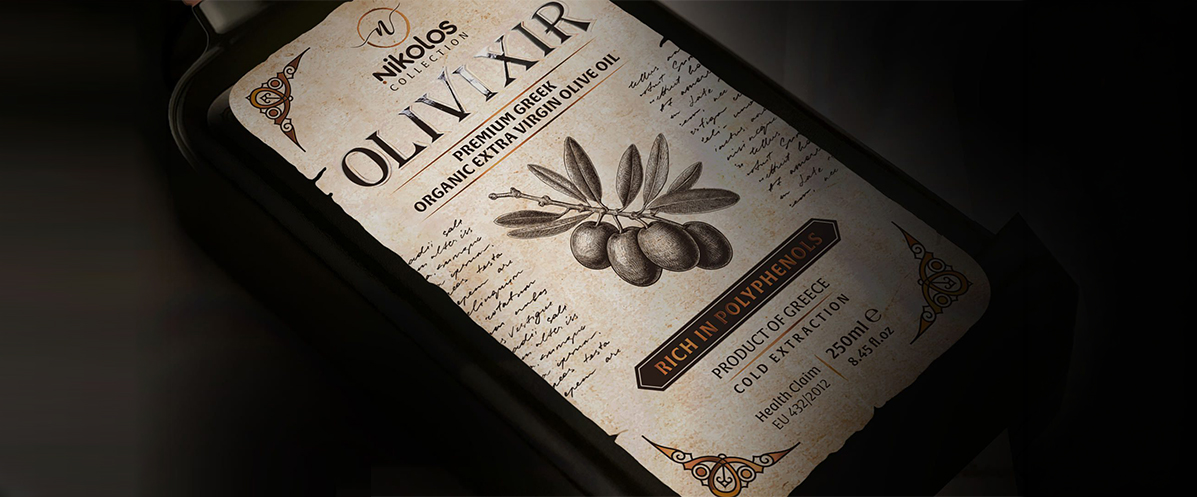 Premium textured label for Olivixir Nikolos Collection organic extra virgin olive oil, featuring a vintage design with torn edges.