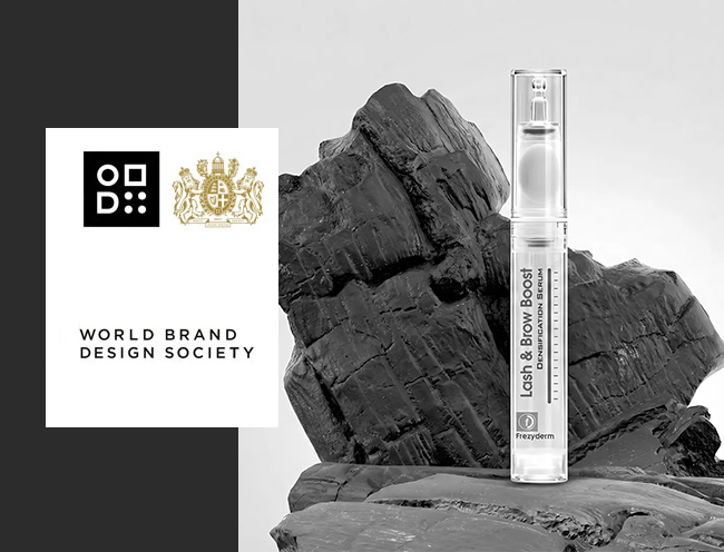 Award-winning premium cosmetic packaging design for Frezyderm Lash and Brow Boost by ABC Design Communication, recognized by the World Brand Design Society, featuring a sophisticated minimalist applicator against a striking dark textured element.