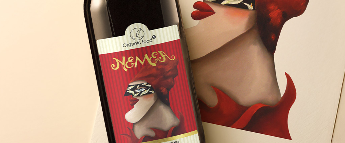 Artistic Nemea wine bottle label featuring gold custom typography and a surreal illustration of a masked woman.