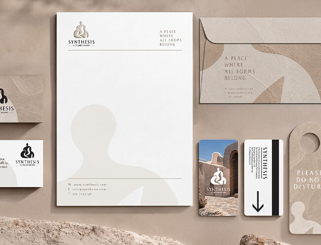 Textured stationery and room keys for Synthesis Resort brand identity design by ABC Design Communication.