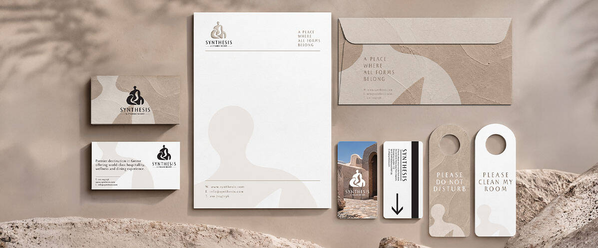 Textured stationery and room keys for Synthesis Resort brand identity design by ABC Design Communication.